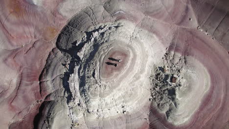Aerial View of Unique Circular Rock Formation in the Desert with Two People