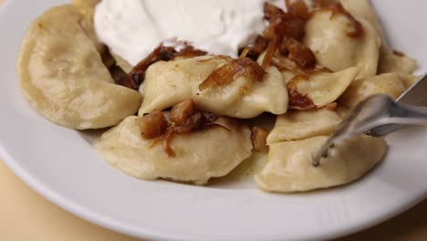 pierogi with sour cream and onions