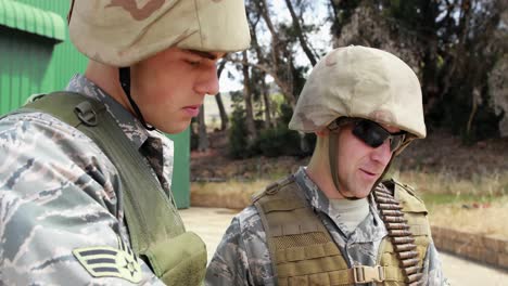 Military-soldiers-interacting-with-each-other-during-training-exercise