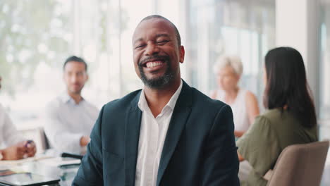 african businessman, smile and face at meeting