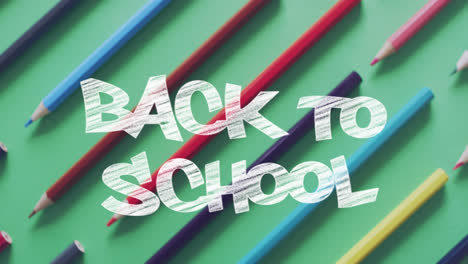 animation of back to school text over pencils on green background