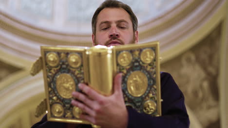 Priest-holding-holy-book