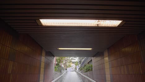 pov walk through pedestrian underpass in cologne, germany