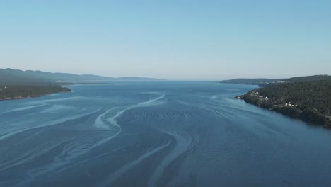 Panoramic-View-Of-The-Gulf-Of-Saint-Lawrence-In-Quebec,-Canada-Under-The-Bright-Blue-Sky---aerial