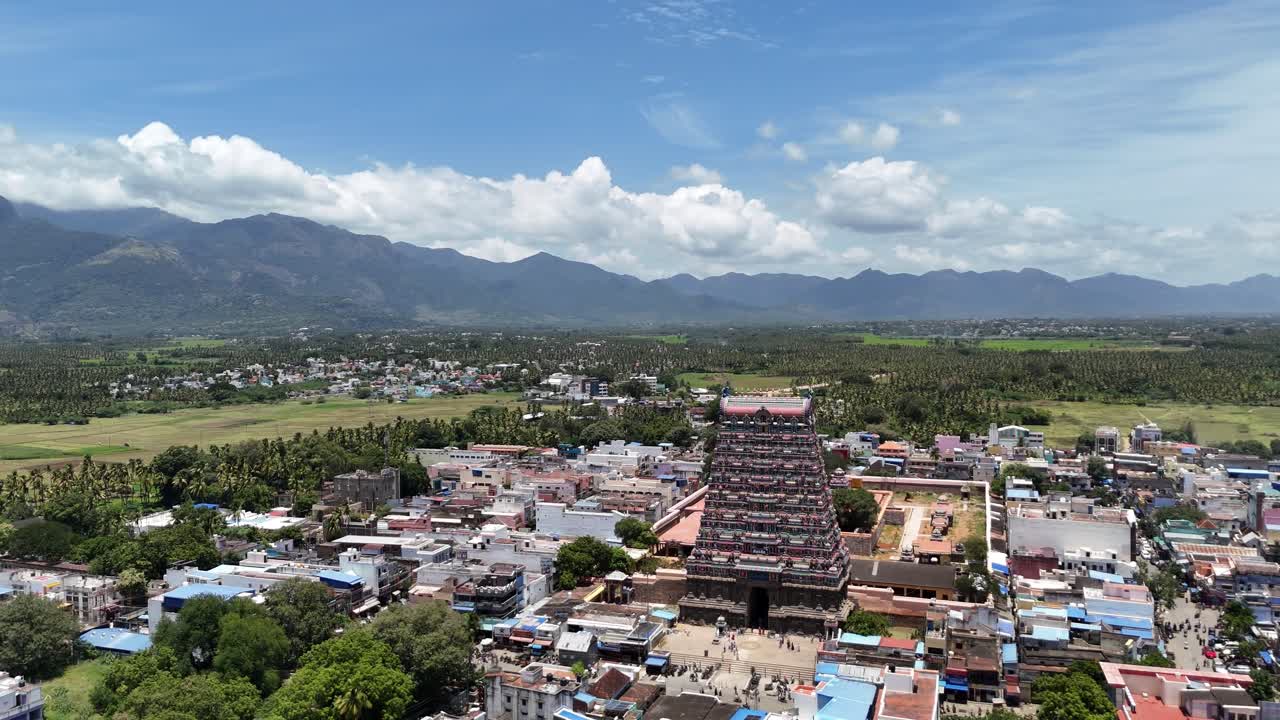 Aerial view of Tenkasi town with the grand Kasi Viswanathar Temple in the center, nestled among lush greenery and scenic mountains in Tamil Nadu