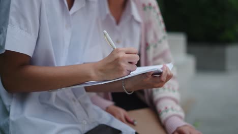 students writing notes
