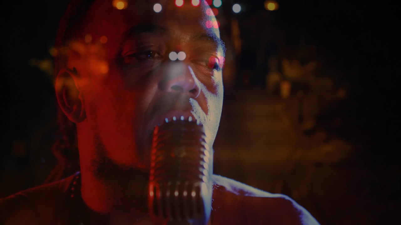 Male singer performing with retro microphone at music event, animating sound waves and bokeh lights