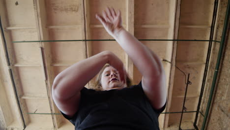 woman dancing indoors