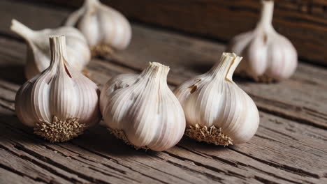 fresh garlic bulbs on a wooden table