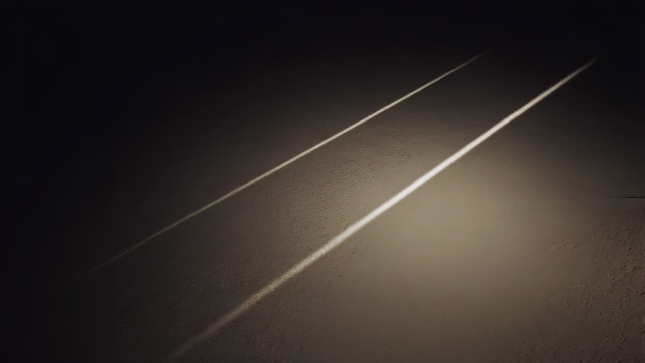 Parallel Beams of Light on a Dark Textured Wall