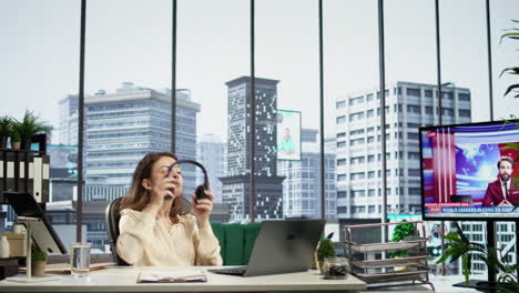 powerful female leader grabbing her headphones for productivity in smart office