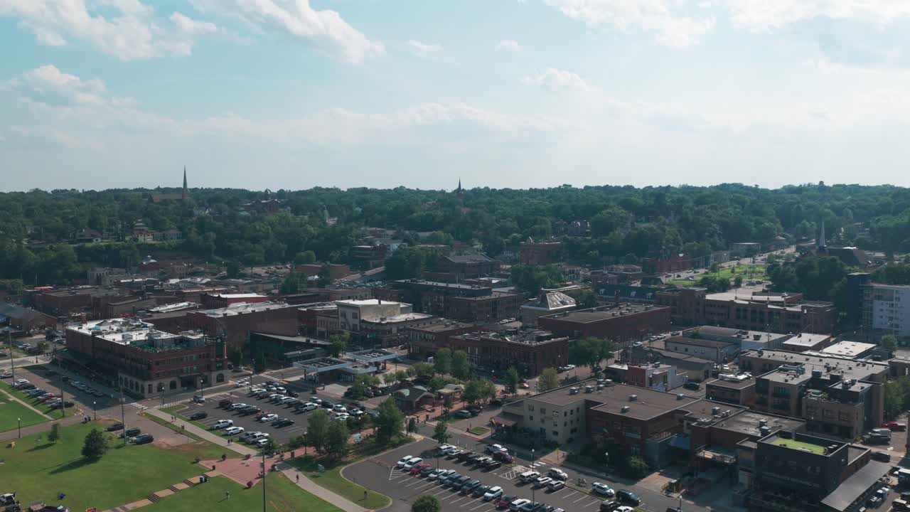 Wide panning aerial shot of historic downtown Stillwater on the St. Croix River in Minnesota. 4K