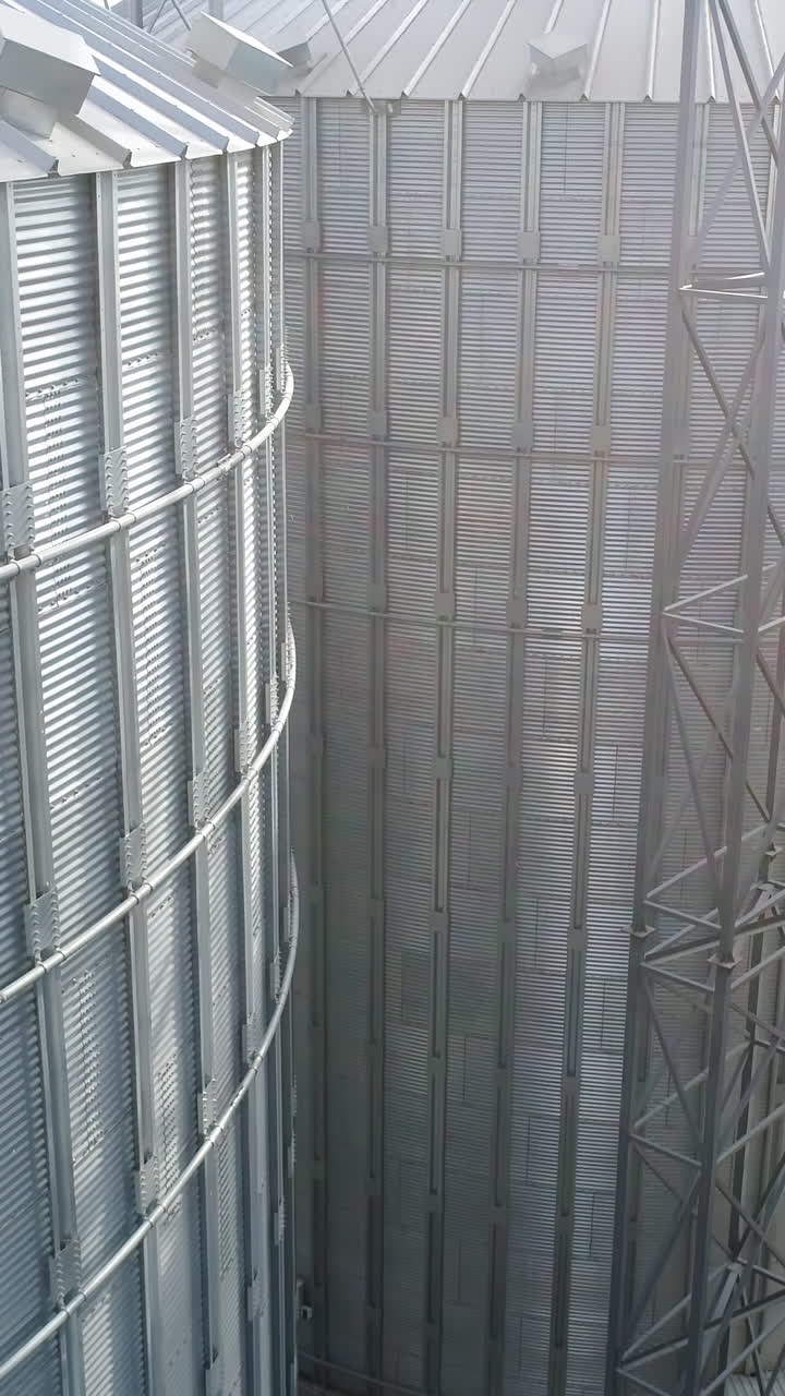 Big metal factory construction. Petrol huge metal equipment. Aerial view. Vertical video