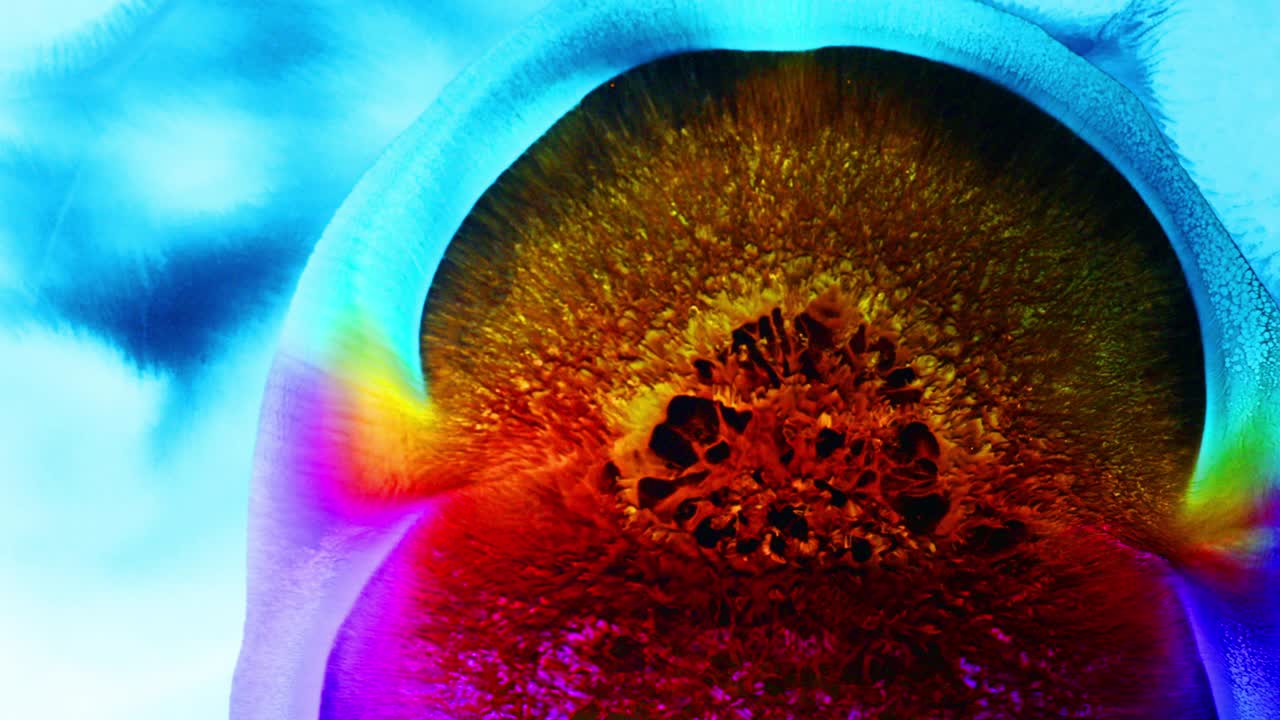 Colorful rainbow reaction with liquid ink / oil bloom / Big Bang supernova