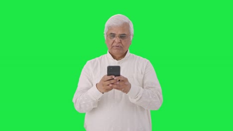 Indian-old-man-chatting-on-phone-Green-screen