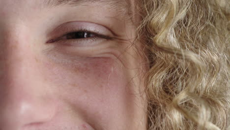 close up young man eye looking happy caucasian male healthy eyesight blonde hair