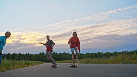 young long boarders skating and doing tricks