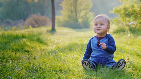 A-Little-Cool-Boy-Sits-On-A-Green-Meadow-1