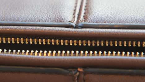 close-up of a brown leather zipper