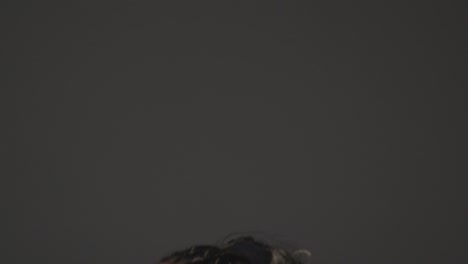 Studio-Shot-Of-Woman-Wearing-Gym-Fitness-Clothing-Exercising-With-Kettlebell-Weights-4