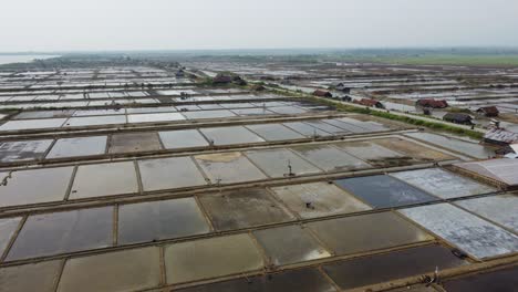 aerial drone view of view of the vast expanse of salt ponds in jepara, central java, indonesia