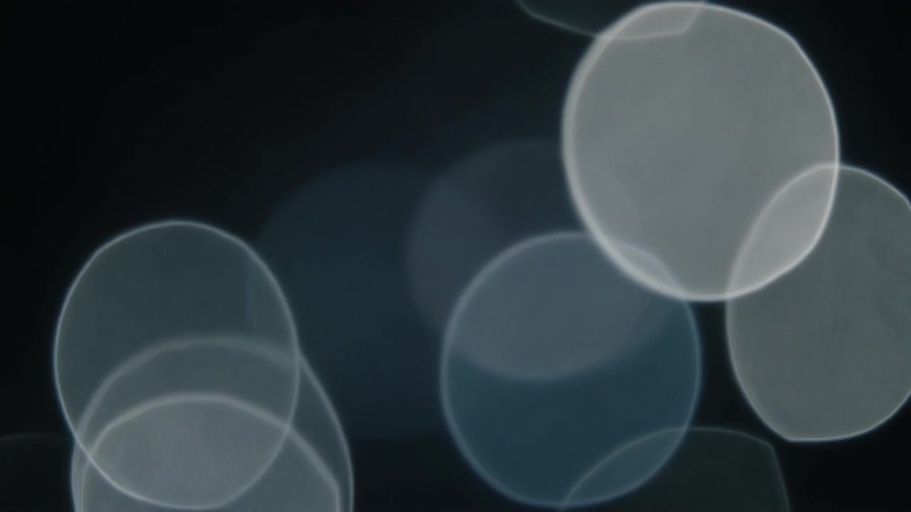 Abstract Background of Soft Glowing White and Blue Bokeh Circles