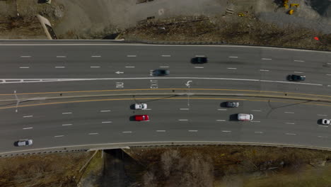 High-angle-footage-of-traffic-on-highway.-Colourful-vehicles-driving-in-different-lanes-on-wide-road.-Boston,-USA