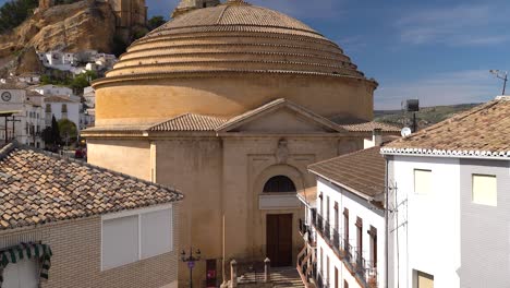 Famous-round-church-in-Montefrio,-slow-tilting-up-shot