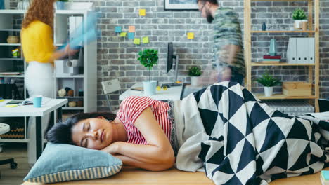 woman taking a nap in an office