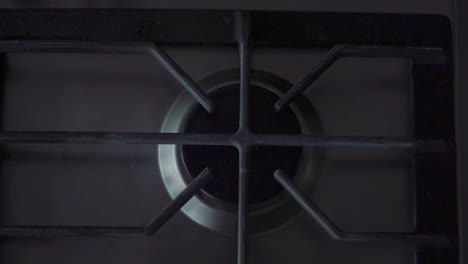 A-shot-from-above-of-a-gas-stove-being-lit-in-slow-motion