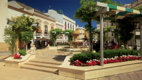 sunny day in a spanish plaza with fountain