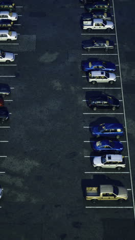 nighttime parking lot with numerous parked vehicles at a commercial area