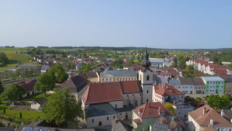 amazing aerial top view flight church in village heidenreichstein, city in austria europe, summer day of 2023