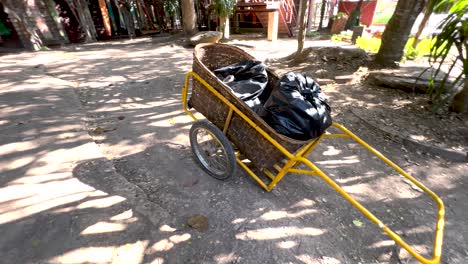 a cart moves through a shaded pathway