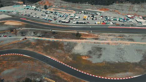 Drone-shot-of-a-race-track-with-motorcycles-racing