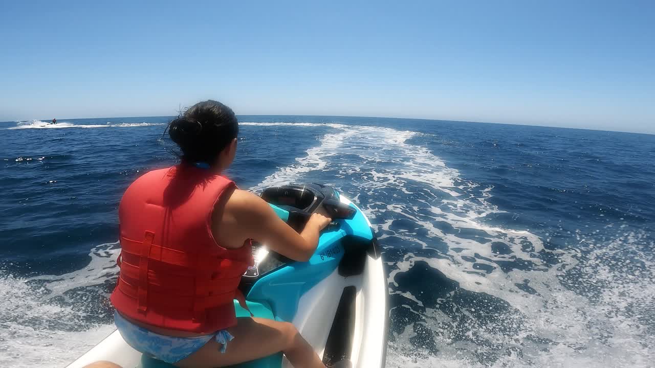 Woman riding a jetski on the ocean