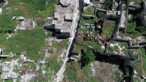 aerial view above ruins of buildings in aleppo covered with grass with time 4k