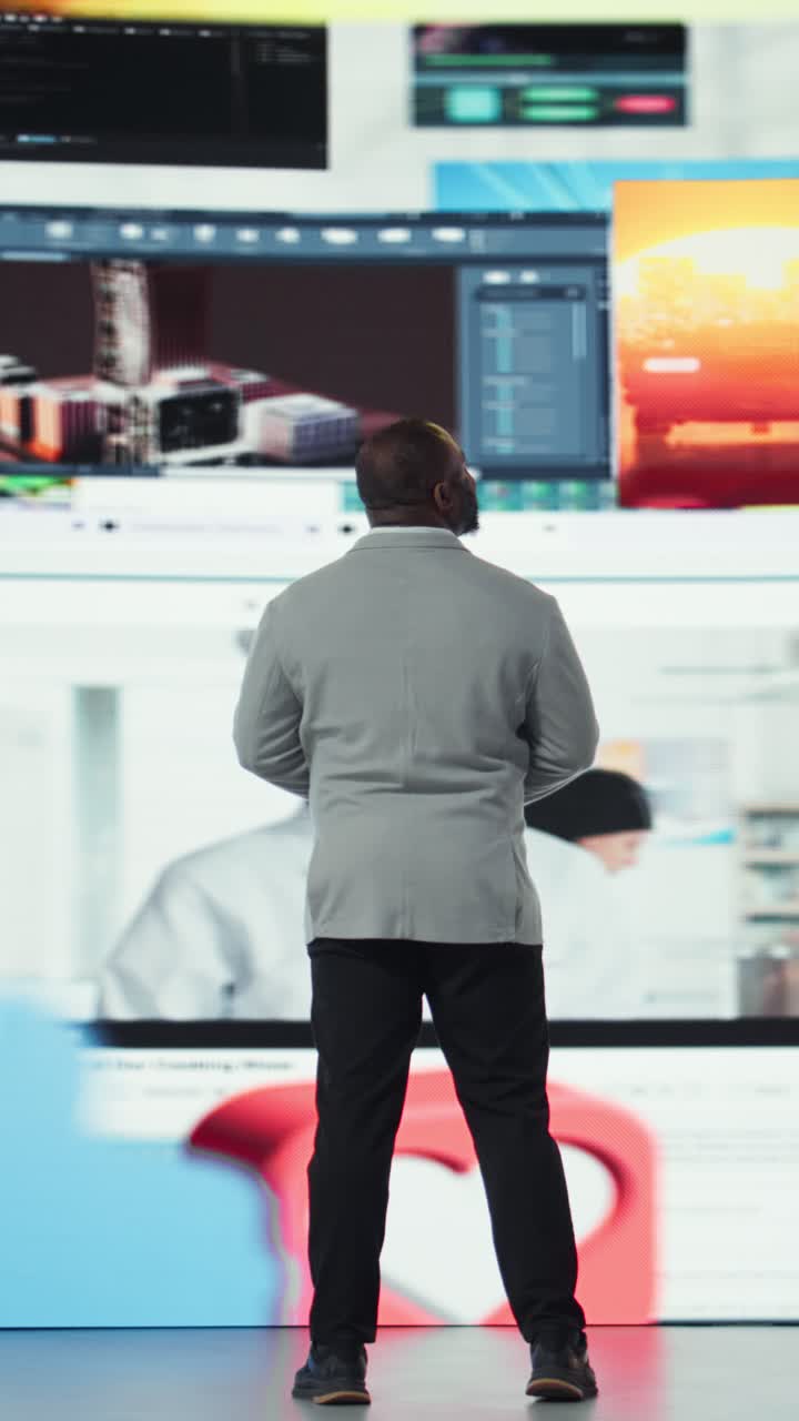 Vertical video Delighted man accessing streaming videos, entering world of online media