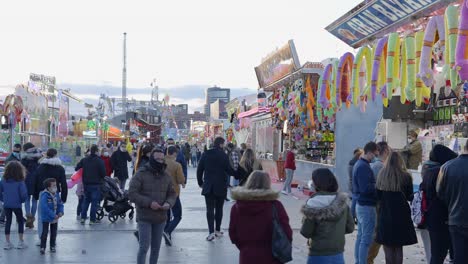crowd at a winter fair with covid precautions
