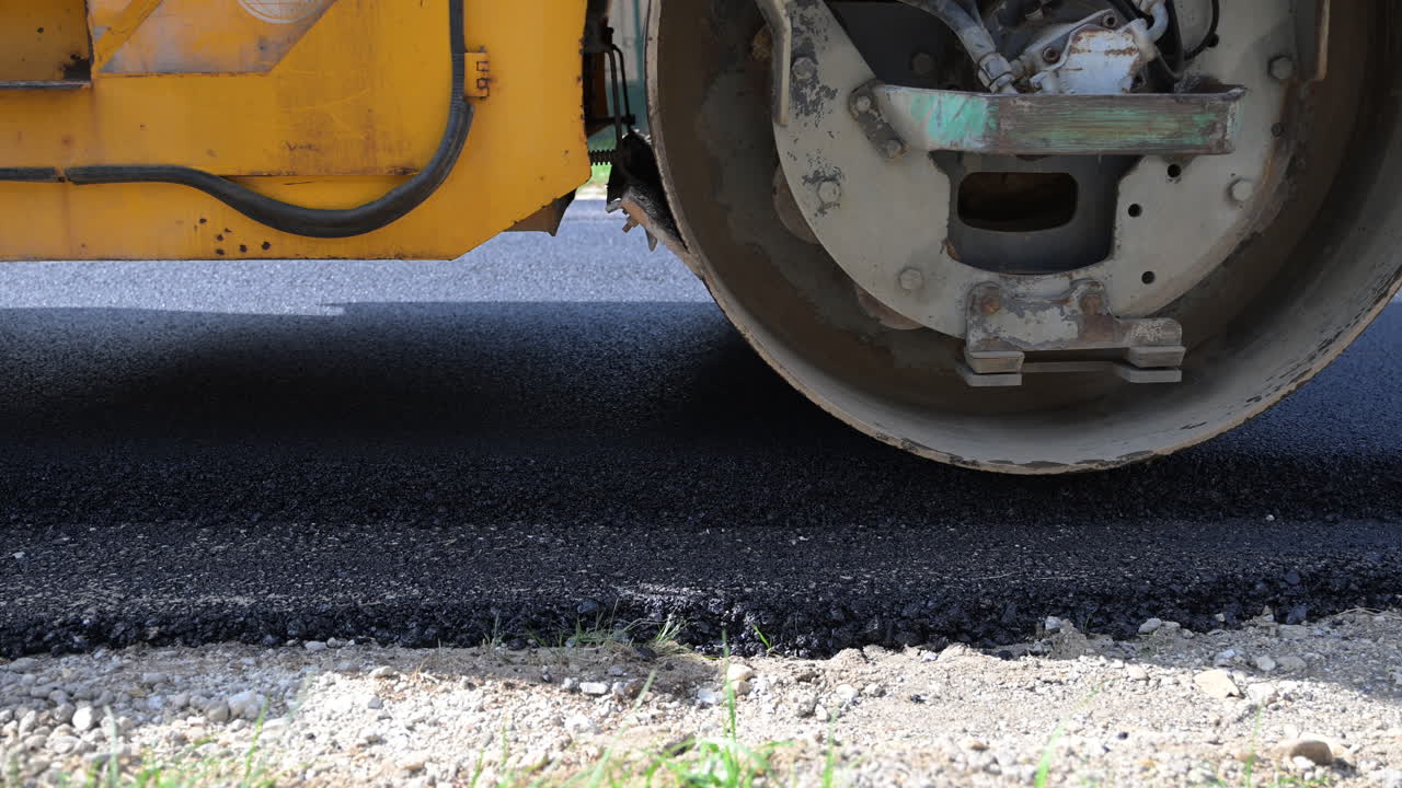 Freshly paved asphalt road in residential area