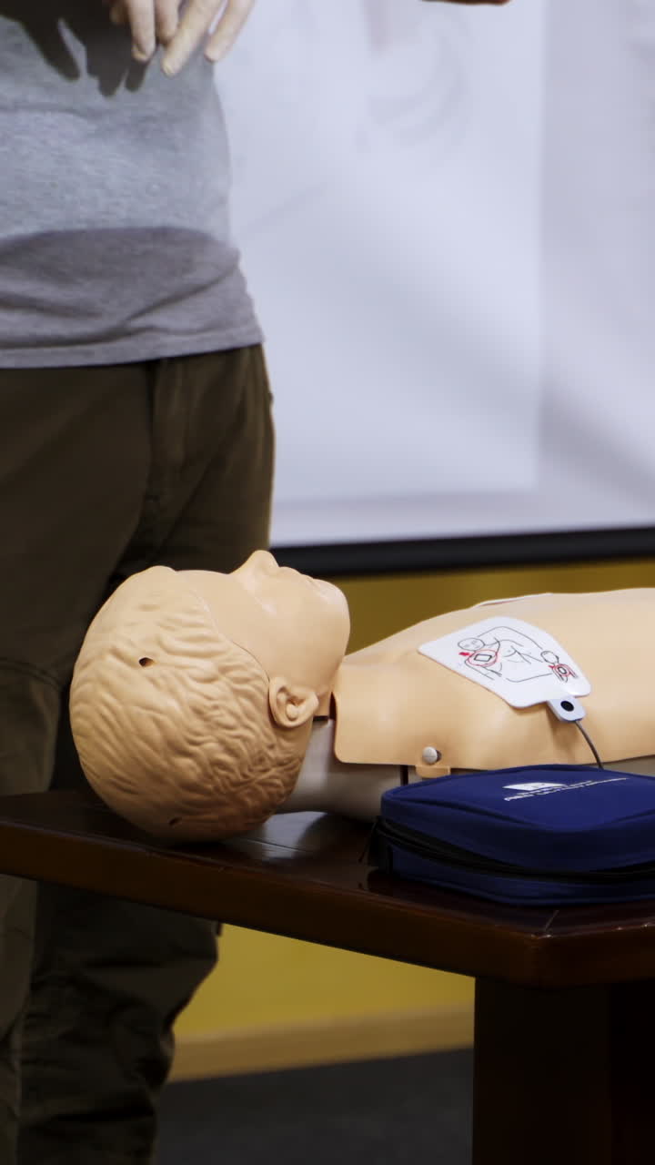 Training dummy used by paramedic trainees. Special dolls for medical trainings. Seminar for medics. Vertical video