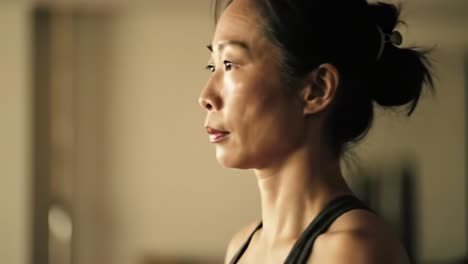A Focused Moment: A Profile View of a Concentrated Woman in a Calm Environment, Emphasizing Inner Strength and Determination Amidst Soft Lighting