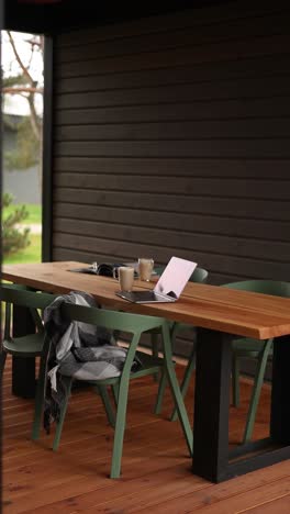 cozy outdoor workspace in a wooden pergola