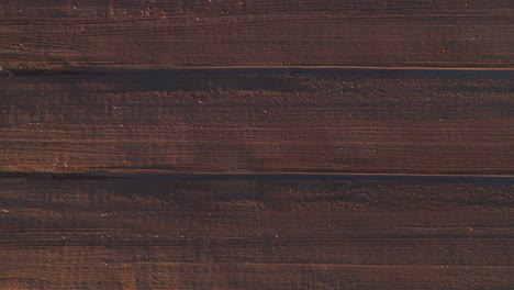 aerial view of the large wide brown peat field in kaunas county, lithuania