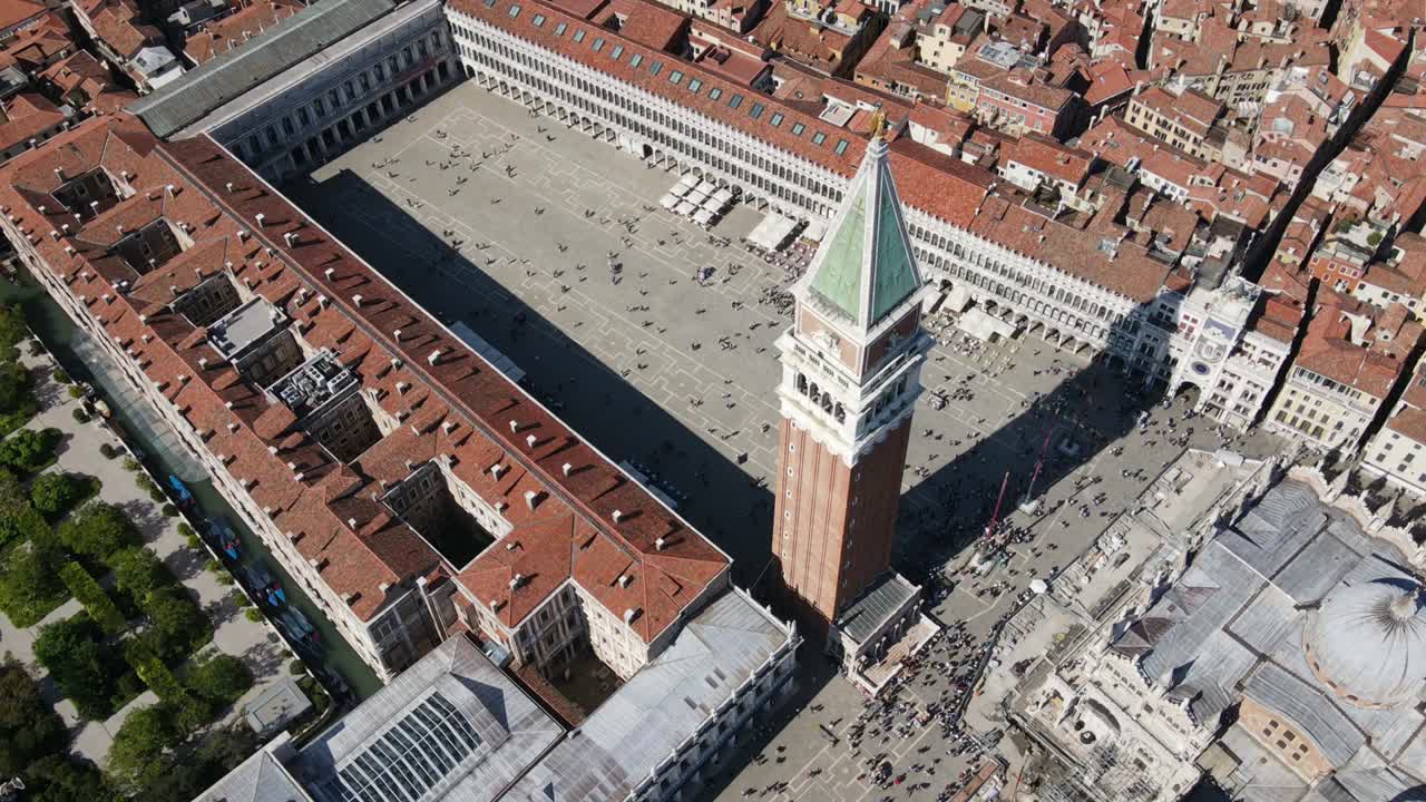 aerial drone circular wrap timelapse of St Mark's square in Venice Italy midday lots of tourists with beautiful classic venetian architecture