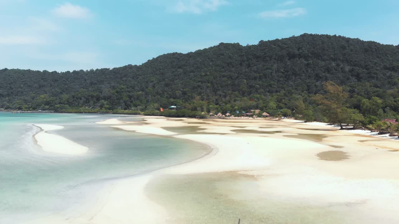 Paradisiac white beach with hammocks near the calm sea water