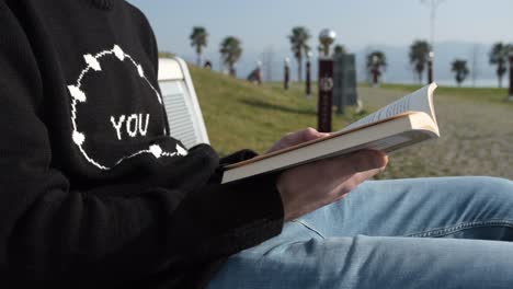 Reading-Book-On-Bench