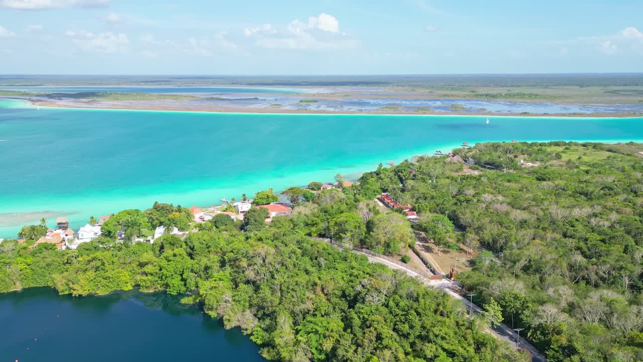 Bacalar lagoon aerial view, showcasing turquoise waters and lush greenery in Mexico