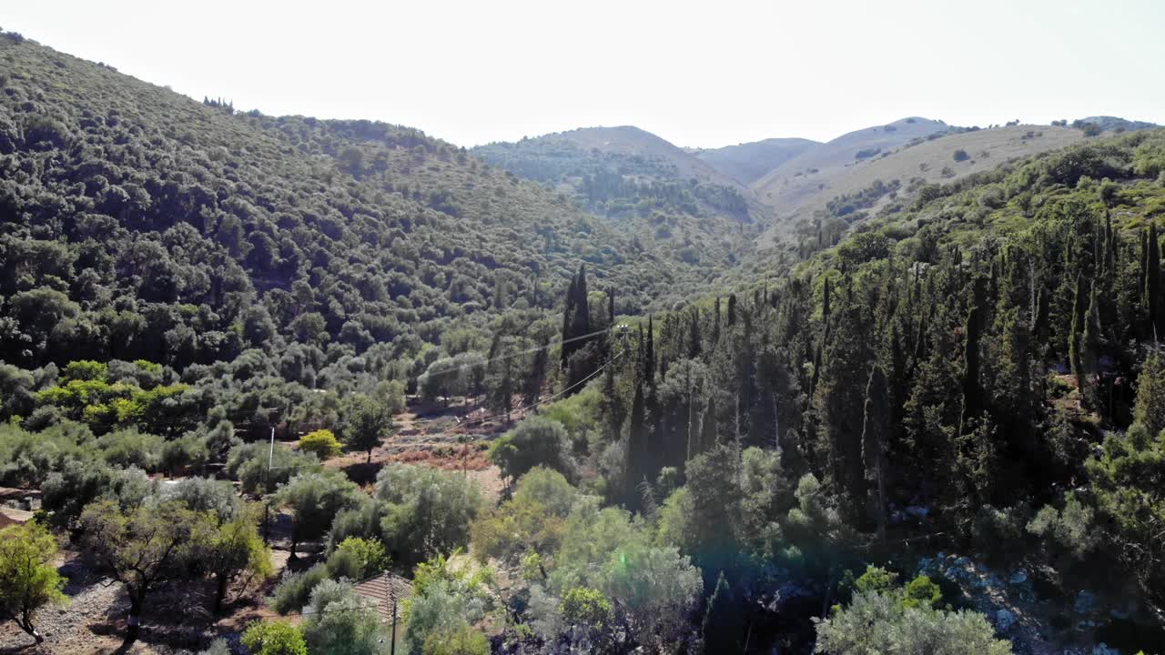 Dense Mountains Revealed Historical Ruins In The Mediterranean Shore Of Agia Sofia Beach In Kefalonia Island, Greece. Aerial Tilt-up