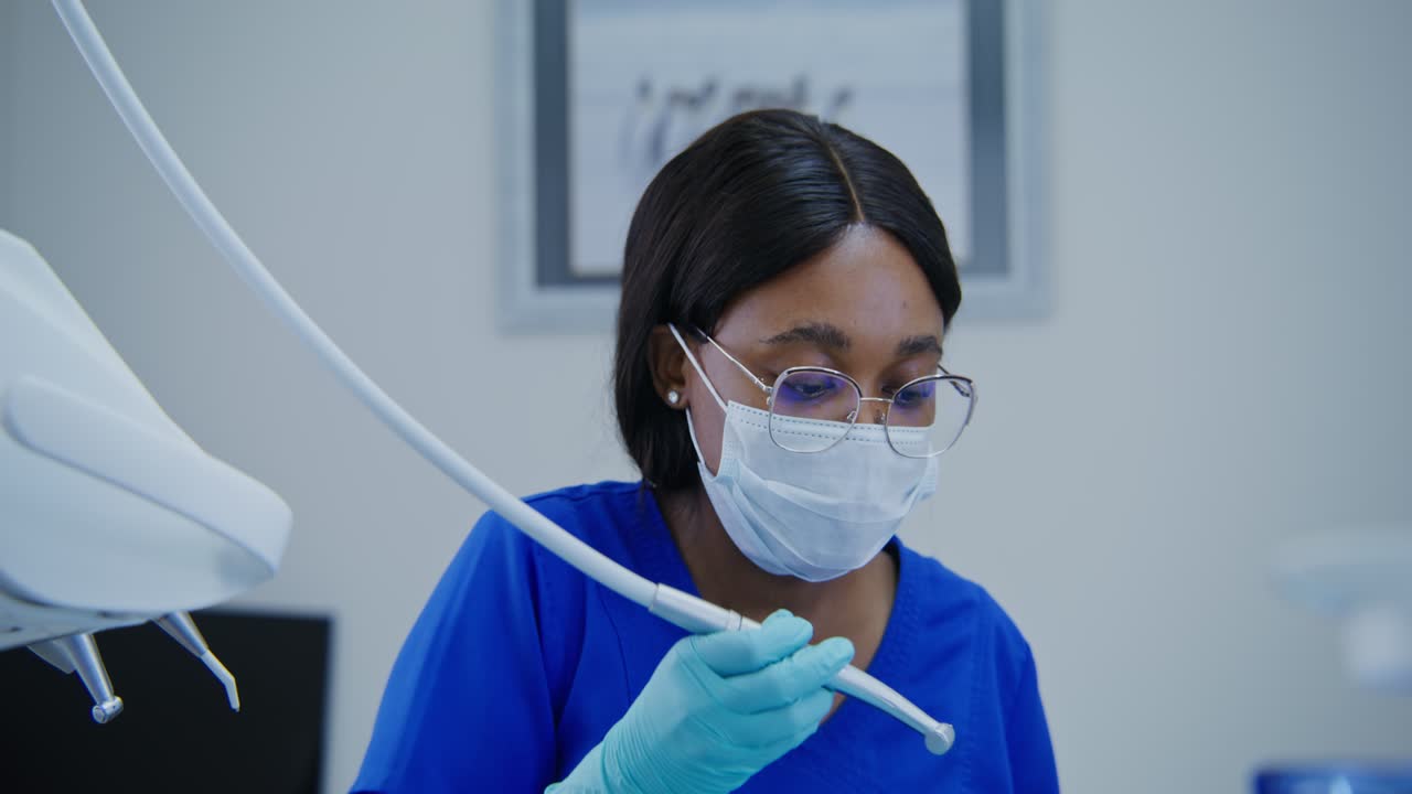 Dentist Performing a Teeth Cleaning Procedure